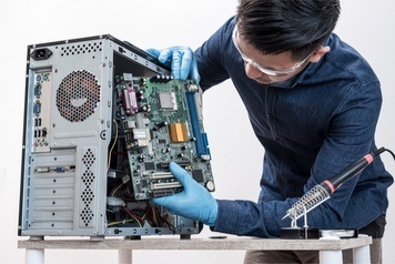 Man repairing a desktop computer