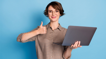The portrait shows a woman holding a laptop and giving a thumbs up. She also has a checkered shirt and is isolated on a blue background.